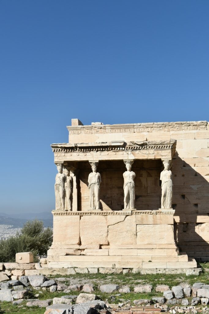 A building with statues on it. nct 