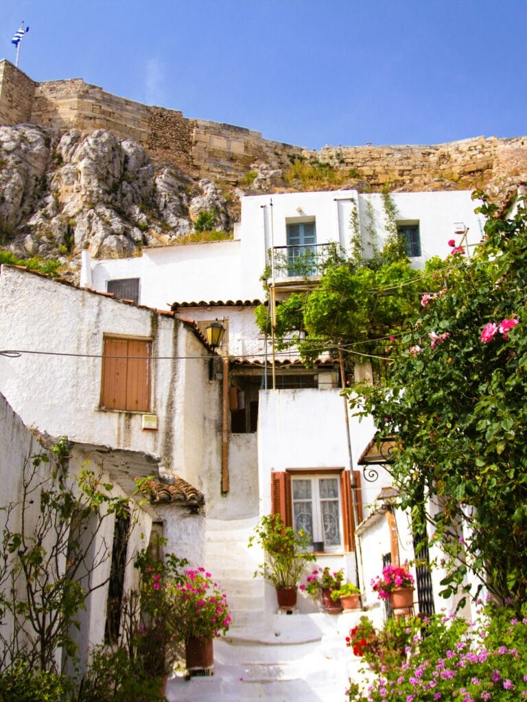 A white building on the side of a hill.