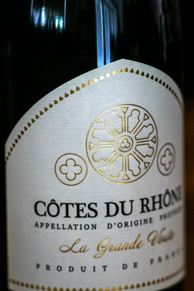 A bottle of wine with a label that says cote du rhone 
