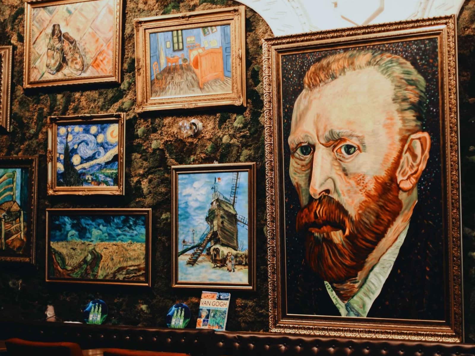Van gogh's paintings on the wall of a restaurant.