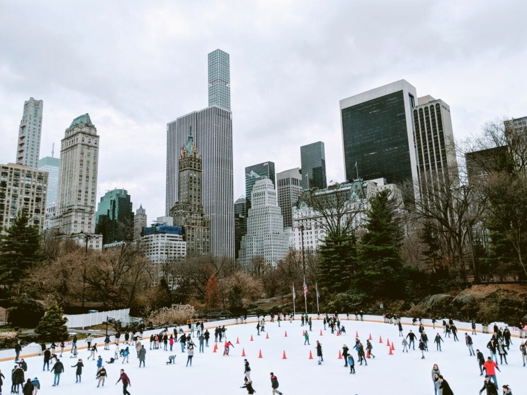 Experience the Christmas spirit at Central Park ice rink in New York City.