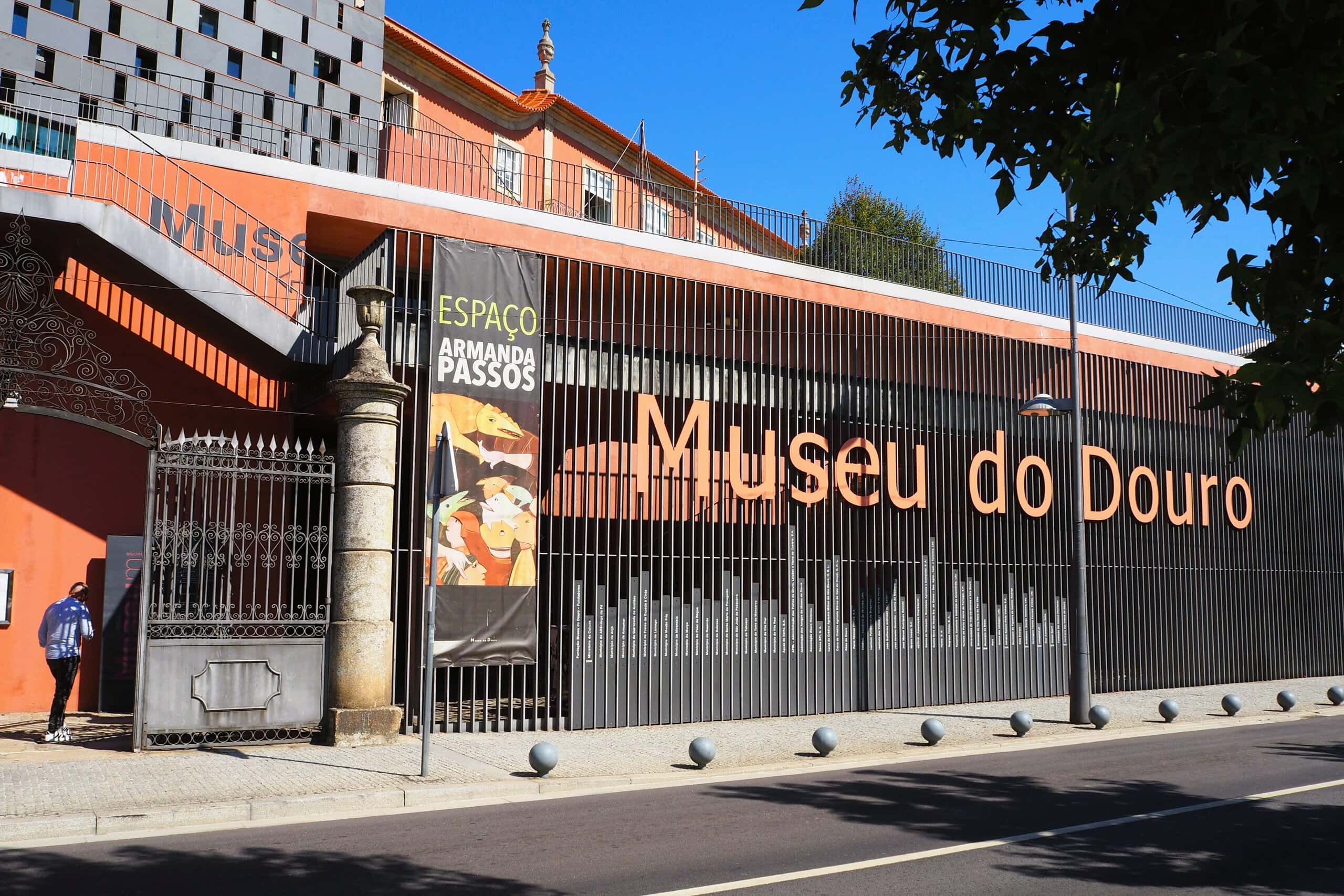 Façade of Museu do Douro with large sign and gate on a sunny day, located in Peso da Régua, Portugal—a highlight among the Best Day Trips from Porto.